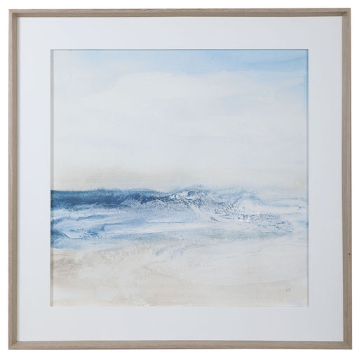 Framed print titled "Surf And Sand" by Uttermost featuring a calming blue ocean scene in a sleek frame.