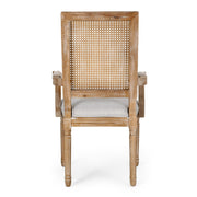 Elegant Noble House French country style dining arm chair with cane backrest and wooden frame.