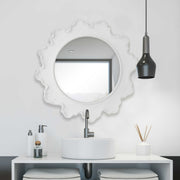 Round white wall mirror with a sea coral-inspired frame by Uttermost, perfect for coastal or nautical decor accents.