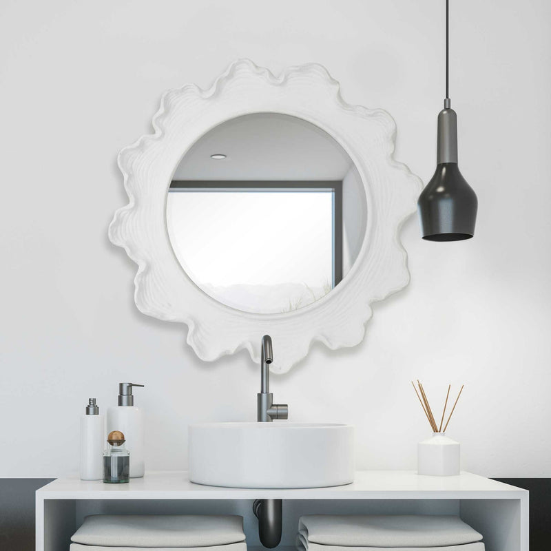 Round white wall mirror with a sea coral-inspired frame by Uttermost, perfect for coastal or nautical decor accents.