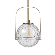 Uttermost Mimas 1 Light Globe Pendant in gold, modern pendant lighting with a spherical glass shade hanging from a sleek fixture.