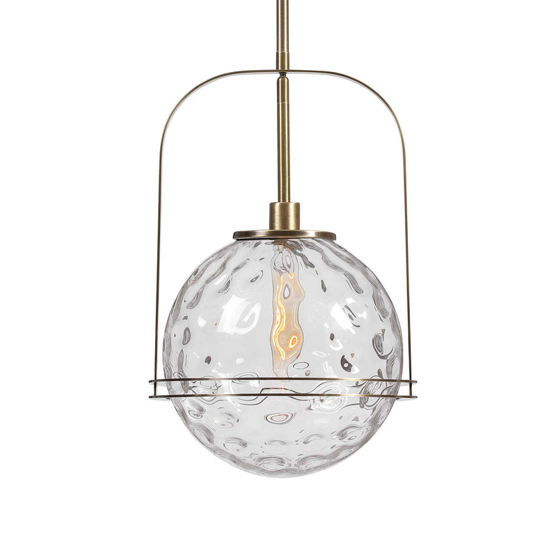 Uttermost Mimas 1 Light Globe Pendant in gold, modern pendant lighting with a spherical glass shade hanging from a sleek fixture.
