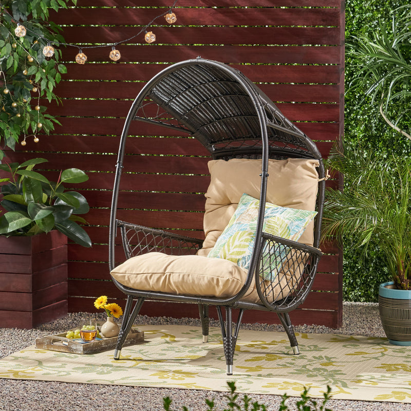 Noble House outdoor wicker standing basket chair with cushion, accent chair for patio or garden seating.