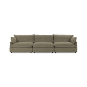 Classic Home Caplan modular sectional with plush cushions and contemporary design, shown in a spacious living room setting.