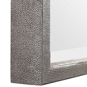 Silver metallic wall mirror by Uttermost with a sleek, round design and reflective surface.