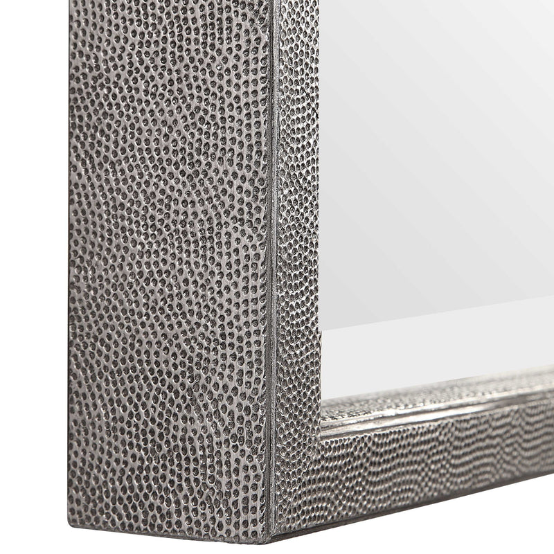 Silver metallic wall mirror by Uttermost with a sleek, round design and reflective surface.