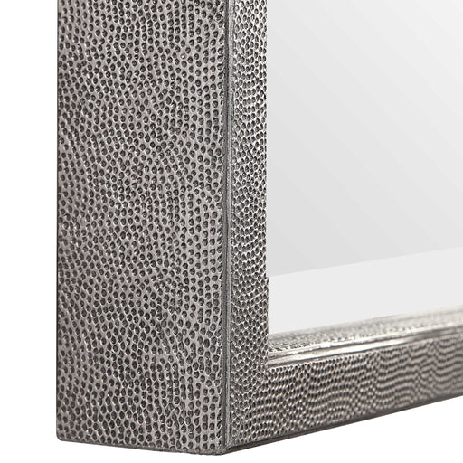 Silver metallic wall mirror by Uttermost with a sleek, round design and reflective surface.
