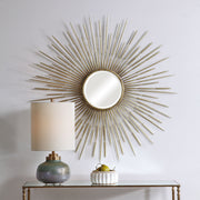 Golden Rays Starburst Mirror by Uttermost, gold wall mirror with a sunburst design and intricate starburst pattern.