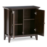 Simpli-Home Amherst handcrafted low storage accent cabinet with wood finish and multiple storage compartments.