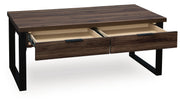 Rectangular Wickman Falls cocktail table by Signature Design Ashley® with a sleek wood finish and modern design.