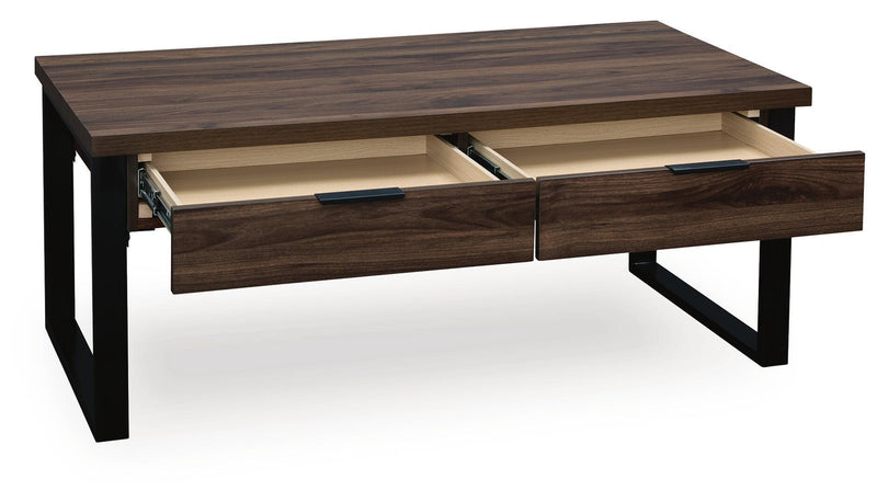 Rectangular Wickman Falls cocktail table by Signature Design Ashley® with a sleek wood finish and modern design.