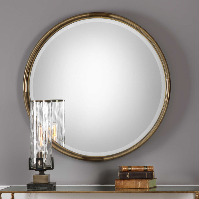 Uttermost Finnick iron coil round wall mirror with gold finish, featuring a stylish, modern design for elegant home decor.