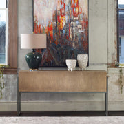 Contemporary light brown Nevis console table by Uttermost with sleek design and smooth surface, ideal for modern entryways.