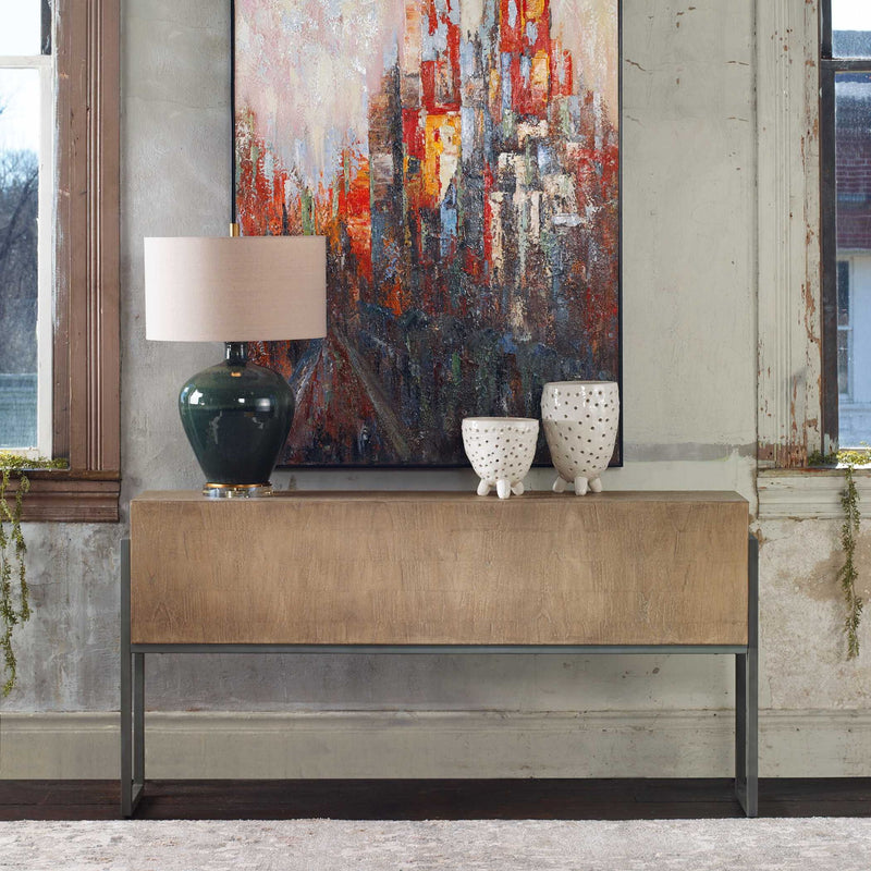Contemporary light brown Nevis console table by Uttermost with sleek design and smooth surface, ideal for modern entryways.