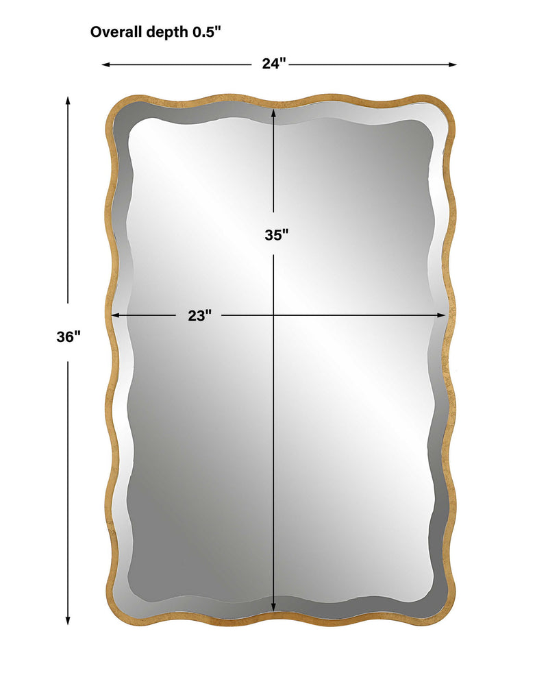 Uttermost Aneta gold scalloped accent mirror with a decorative frame, hanging on a wall with a modern interior background.