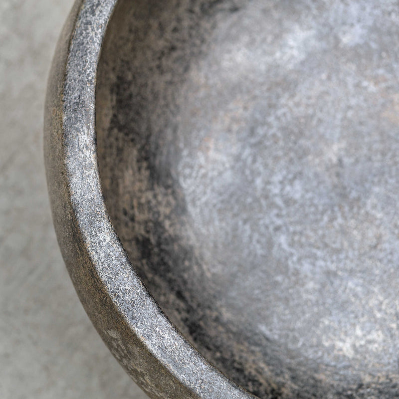 Uttermost Brixton bowl in aged black ceramic with a textured, matte finish, perfect for serving or decorative use.