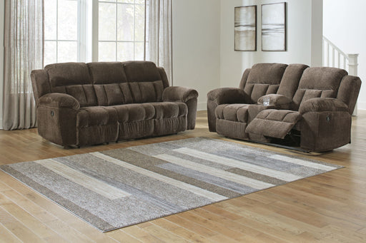 Signature Design by Ashley reclining living room set with plush sofas and loveseats featuring comfortable cushions and modern style.