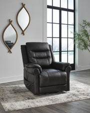 Signature Design by Ashley Oatman Power Lift Recliner in soft fabric with padded armrests and reclining feature.