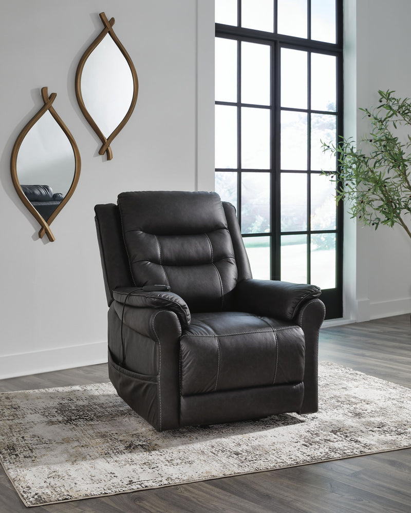Signature Design by Ashley Oatman Power Lift Recliner in soft fabric with padded armrests and reclining feature.