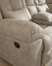 Signature Design by Ashley Pearce-Pike reclining sectional with plush cushions and modern fabric, shown in a living room setting.
