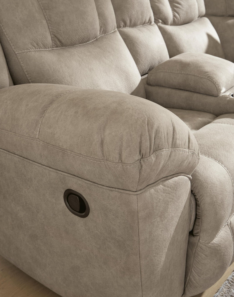 Signature Design by Ashley Pearce-Pike reclining sectional with plush cushions and modern fabric, shown in a living room setting.