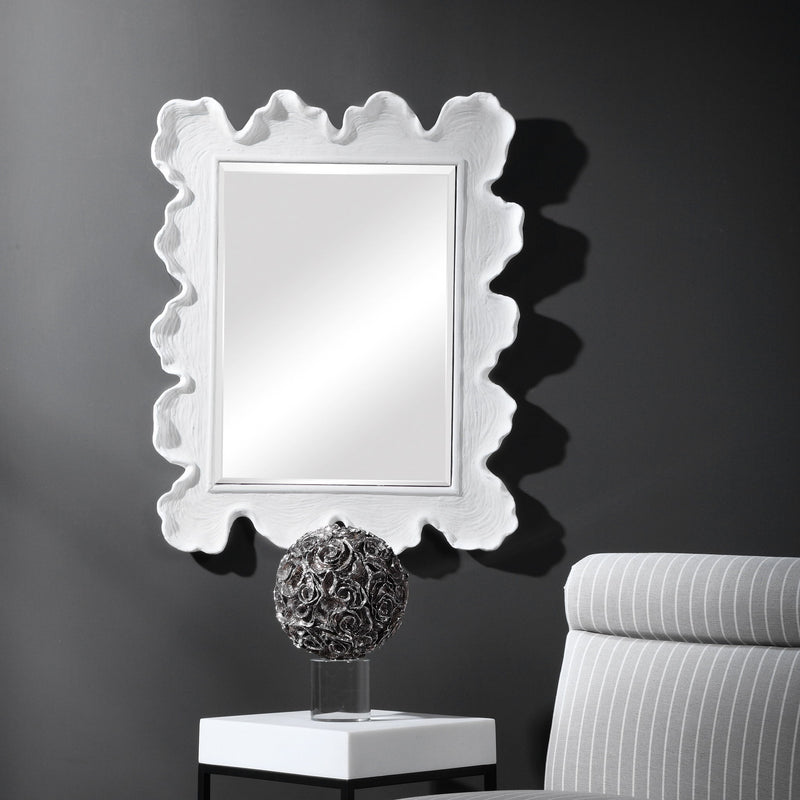 Uttermost Sea Coral wall mirror featuring a decorative coral-inspired frame with a natural, textured design.