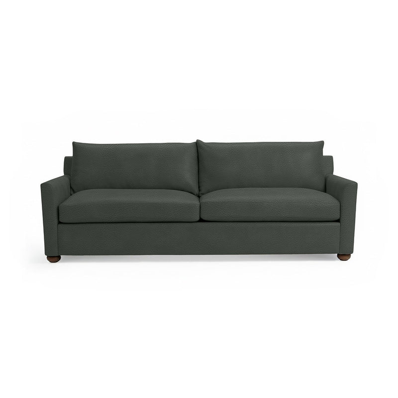 Olivia stationary sofa by Classic Home featuring plush fabric upholstery and a modern design in a cozy living room setting.
