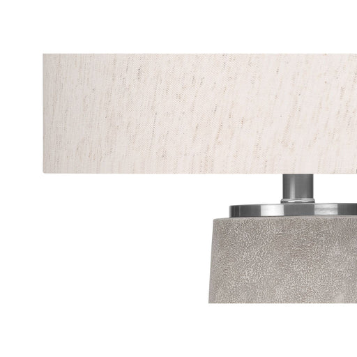 Modern gray resin table lamp by 8th Street, featuring a sleek design suitable for contemporary living spaces.
