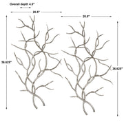 Set of two pearl silver wall decor pieces featuring silver branches by Uttermost, ideal for modern interior decoration.