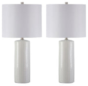 Signature Design by Ashley Steuben table lamp with a sleek base and fabric lampshade, perfect for modern home decor.