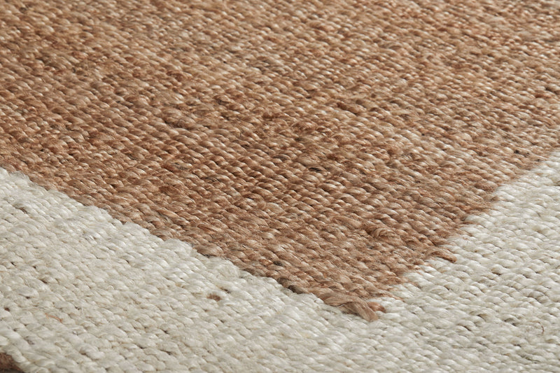 Classic Home Serene Frame Area Rug with intricate pattern in neutral tones, showcasing soft woven texture and decorative border.