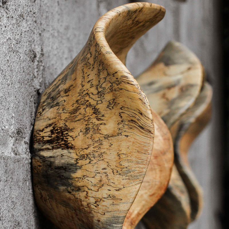 Set of three light brown Tamarine wood wall art pieces by Uttermost, natural textured wall decor for modern interiors.