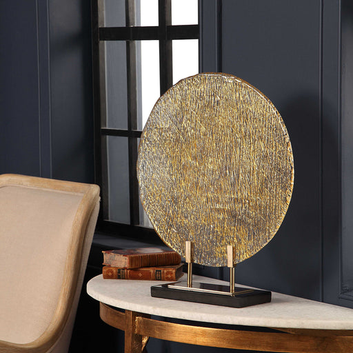 Uttermost Layan Art Glass Charger sculpture in gold with intricate sculpted details, ideal for decorative display.