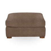 Classic Home Audrey upholstered ottoman with plush fabric and a rectangular shape, perfect as a versatile footrest or accent piece.