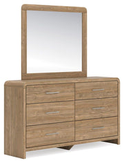Signature Design by Ashley six-drawer dresser with sleek wood finish and modern hardware, showcasing ample storage space.