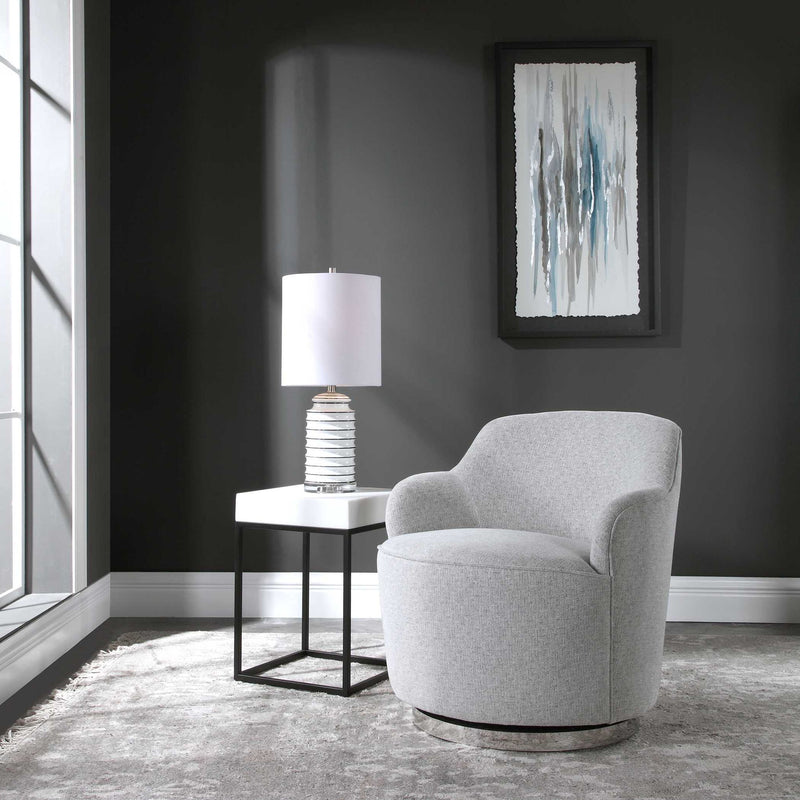 Gray Uttermost Hobart casual swivel chair with a modern design and cushioned seat, featuring a rounded back and sleek base.