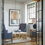 Uttermost seagrass pendant light with a light brown dome shade, showcasing natural woven texture and stylish lighting design.