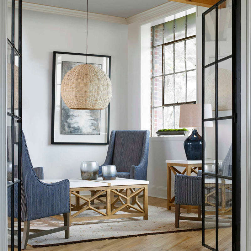 Uttermost seagrass pendant light with a light brown dome shade, showcasing natural woven texture and stylish lighting design.
