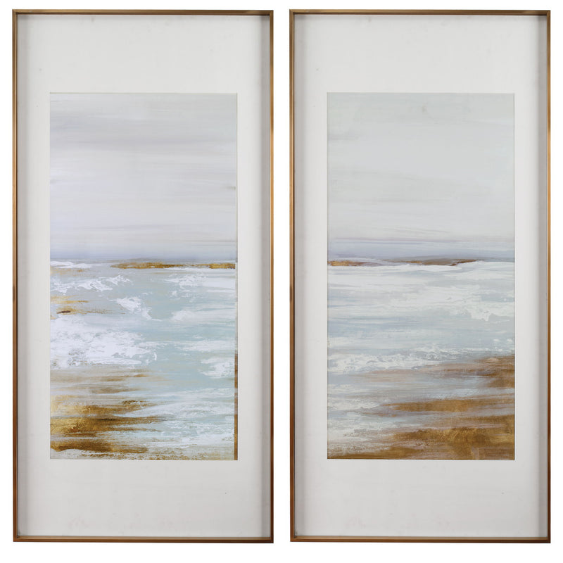 Set of two Uttermost Coastline framed prints with light brown wooden frames, featuring coastal landscape artwork.