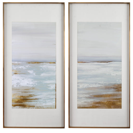 Set of two Uttermost Coastline framed prints with light brown wooden frames, featuring coastal landscape artwork.