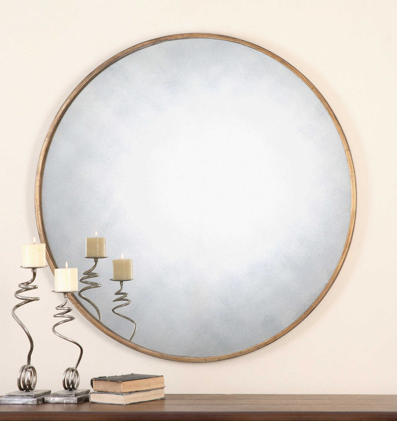 Uttermost Junius round wall mirror with a sleek, modern frame hanging on a wall, ideal for contemporary home decor.
