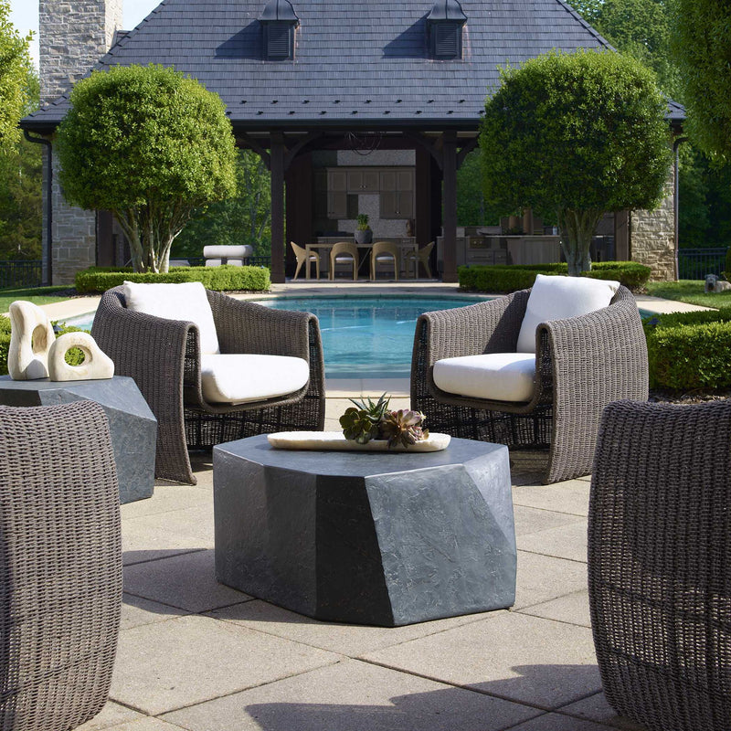 Uttermost Parra outdoor coffee table with a sleek, modern metal frame and a glass top for outdoor patio or garden use.