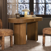Jennifer Taylor Home Jesse single drawer fluted oval console desk in honey brown with tapered legs and sleek design.
