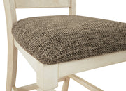 Set of two beige upholstered Bolanburg barstools by Signature Design Ashley with padded seats and wooden legs.