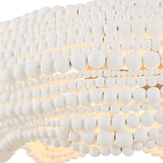 White 5-light beaded pendant lighting by Uttermost, showcasing elegant hanging beads and modern design.