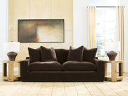 Benchcraft® Maxton Heights stationary sofa with plush cushions and modern design, shown in a stylish living room setting.