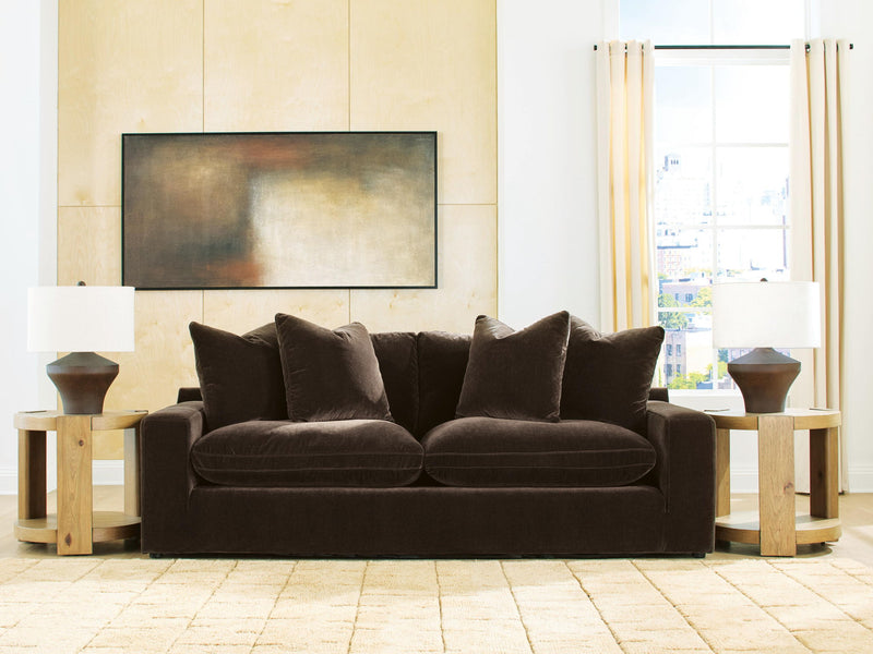 Benchcraft® Maxton Heights stationary sofa with plush cushions and modern design, shown in a stylish living room setting.