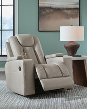 Signature Design by Ashley Elevate Edges Glider Recliner in Coin fabric, featuring plush cushioning and smooth gliding mechanism.