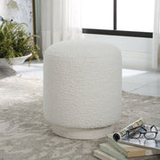 Uttermost Avila accent ottoman with a plush upholstered top and decorative wooden legs, ideal for living room or bedroom decor.
