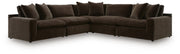Benchcraft Maxton Heights stationary sectional with plush fabric upholstery and modern design, shown in a spacious living room setup.